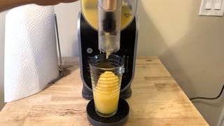 Ninja Slushi machine making orange slushie