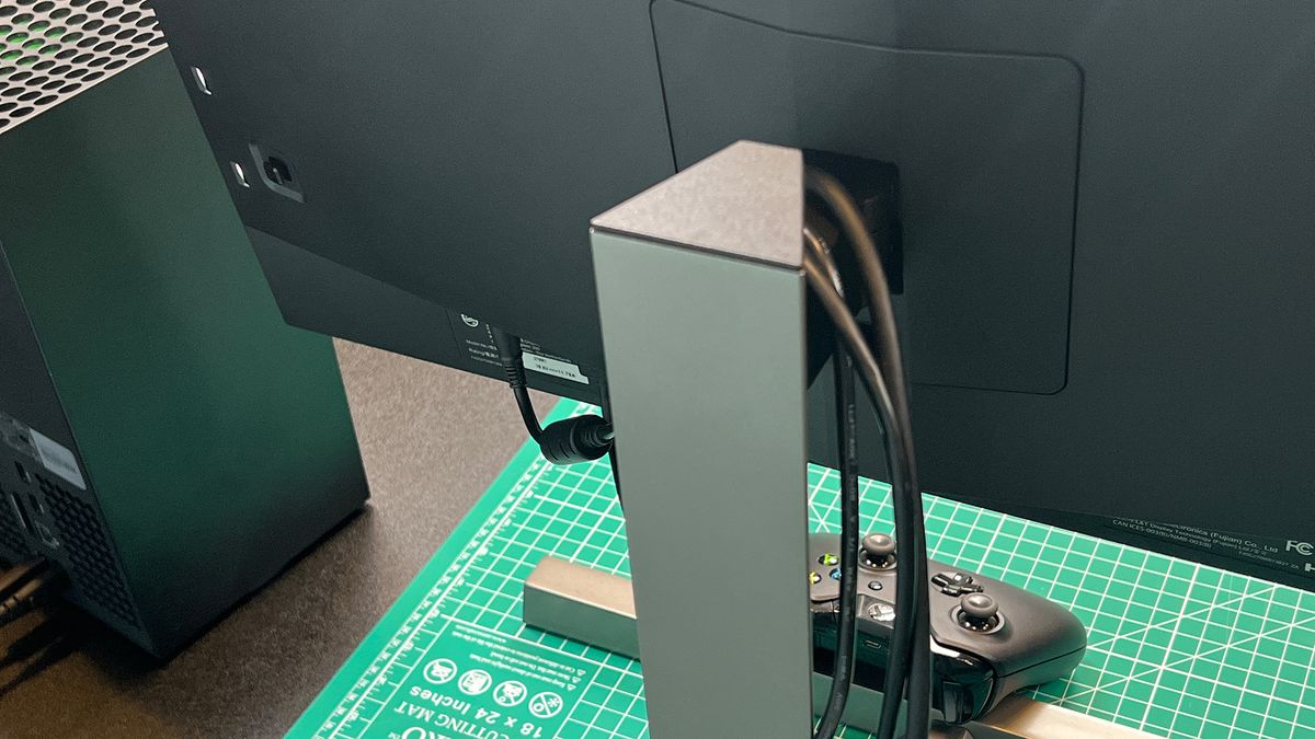 A Philips Momentum 279M1RV on a desk next to an Xbox
