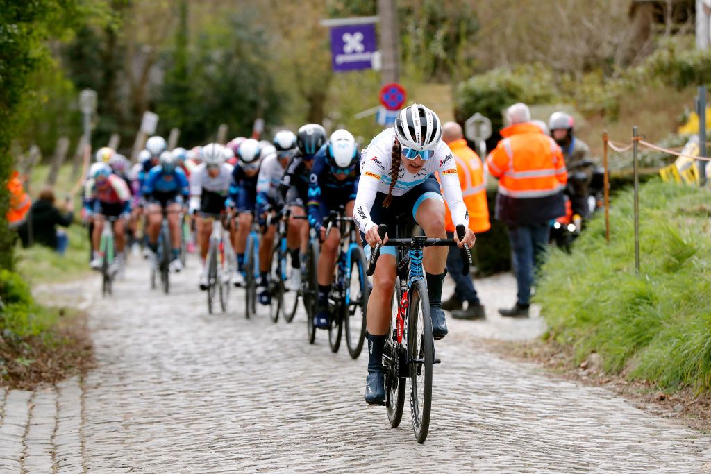 OUDENAARDE BELGIUM APRIL 03 Lucinda Brand of Netherlands and Team Trek Segafredo leads the peloton through cobblestones sector during the 19th Ronde van Vlaanderen Tour des Flandres 2022 Womens Elite a 1586km one day race from Oudenaarde to Oudenaarde RVV22 RVVwomen on April 03 2022 in Oudenaarde Belgium Photo by Bas CzerwinskiGetty Images