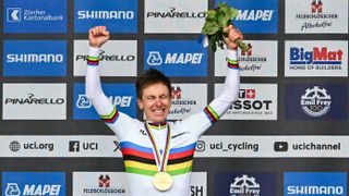 Winner Slovenia's Tadej Pogacar celebrates during the podium ceremony of the men's Elite Road Race cycling event as part of the UCI 2024 Road World Championships, in Zurich, on September 29, 2024. 