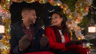 Devale Ellis as Teddy and Christina Milian as Layla in Meet Me Next Christmas 