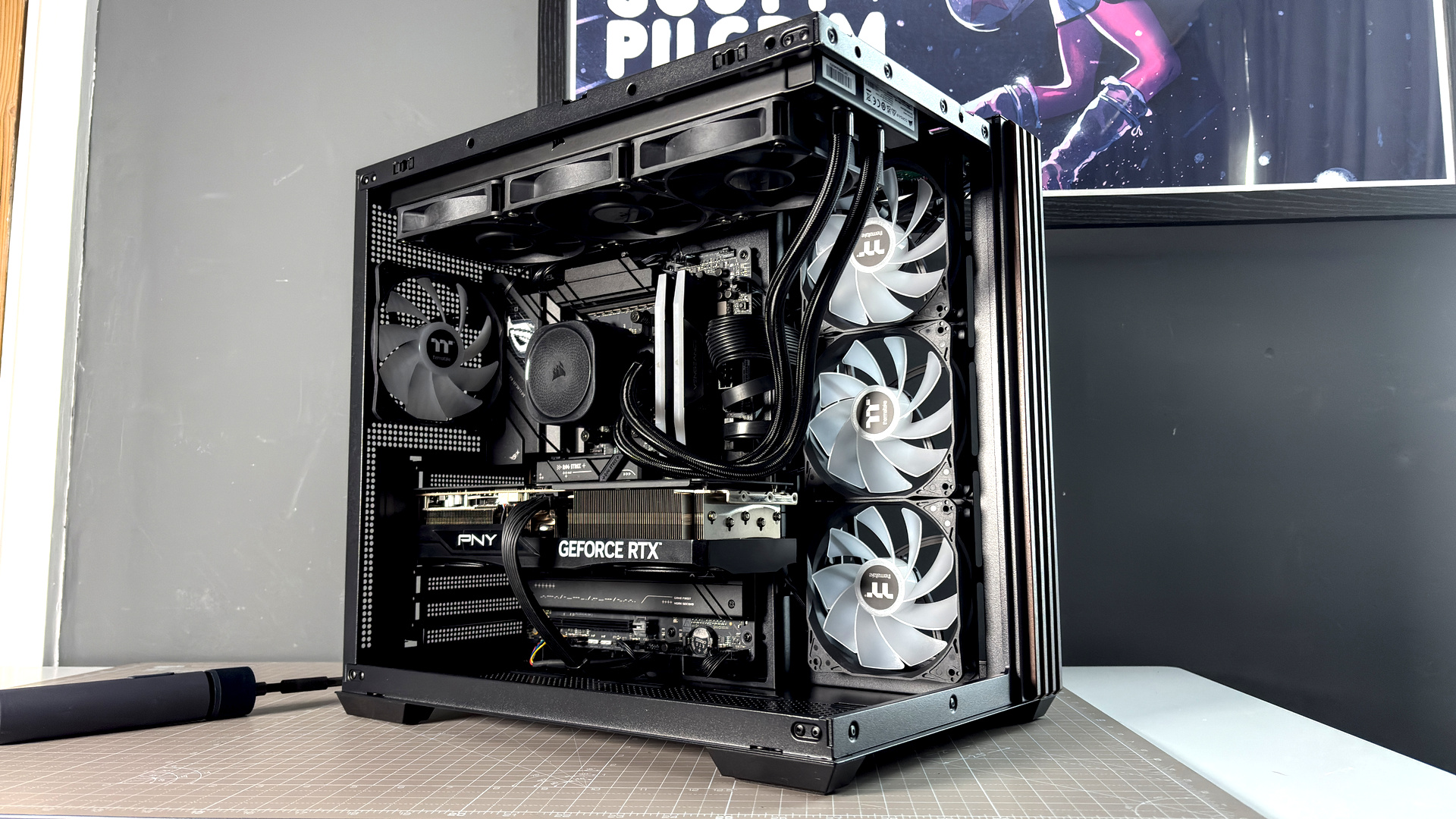 The Thermaltake View 380 WS ARGB on a desk with various components fitted.