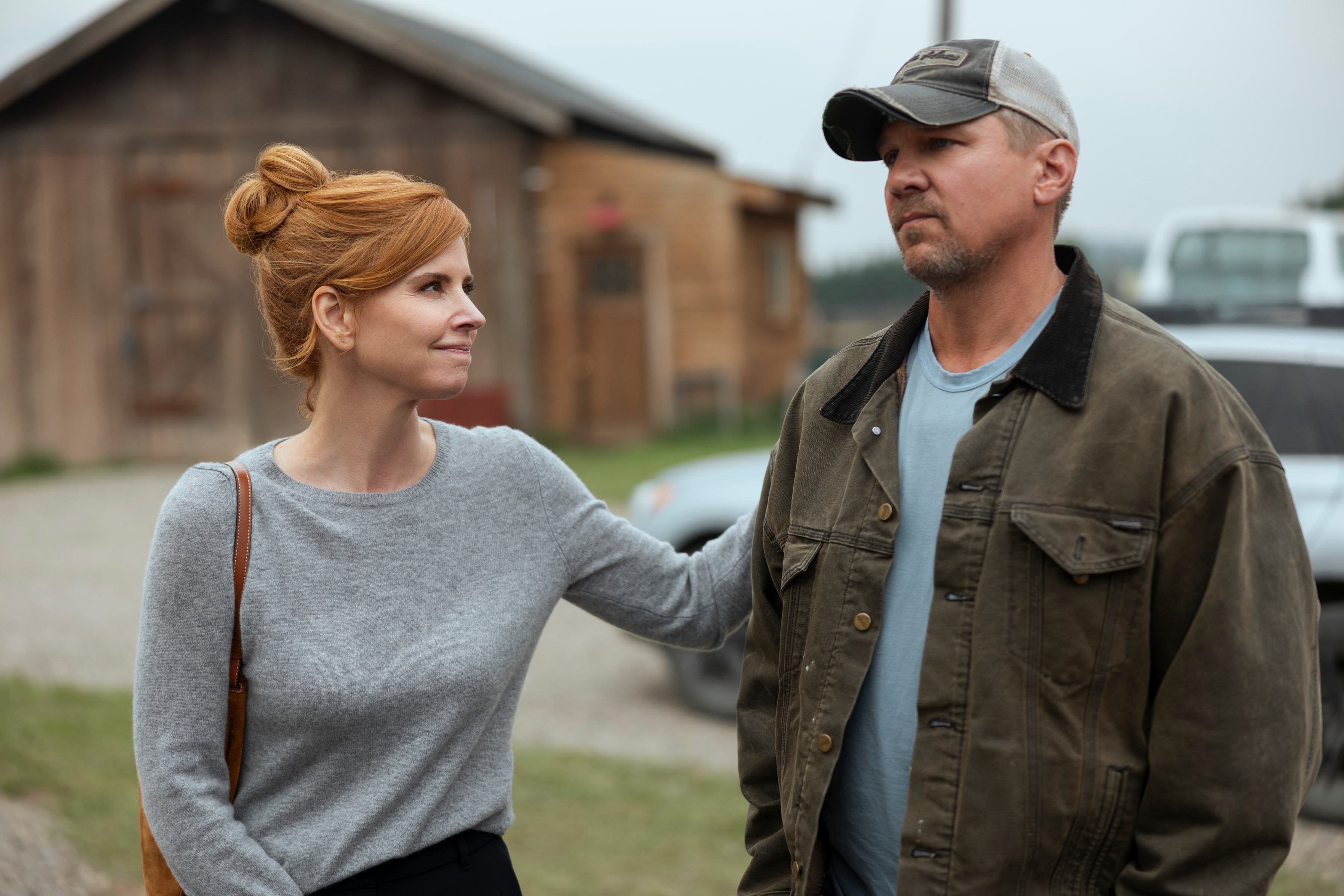 Sarah Rafferty as Katherine putting her arm on Marc Blucas as George&#039;s shoulder outside of the barn in My Life with the Walter Boys season 2