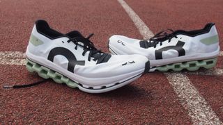Pair of On Cloudboom Echo shoes on a running track