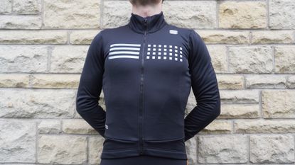 Image shows a rider wearing the Sportful Tempo Jacket.