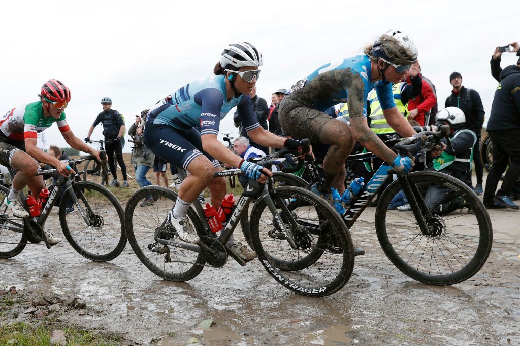 ROUBAIX FRANCE OCTOBER 02 LR Elisa Longo Borghini of Italy and Team Trek Segafredo Audrey CordonRagot of France and Team Trek Segafredo and Emma Norsgaard Jorgensen of Denmark and Movistar Team compete through cobblestones sector during the 1st ParisRoubaix 2021 Womens Elite a 1164km race from Denain to Roubaix ParisRoubaixFemmes ParisRoubaix on October 02 2021 in Roubaix France Photo by Bas CzerwinskiGetty Images