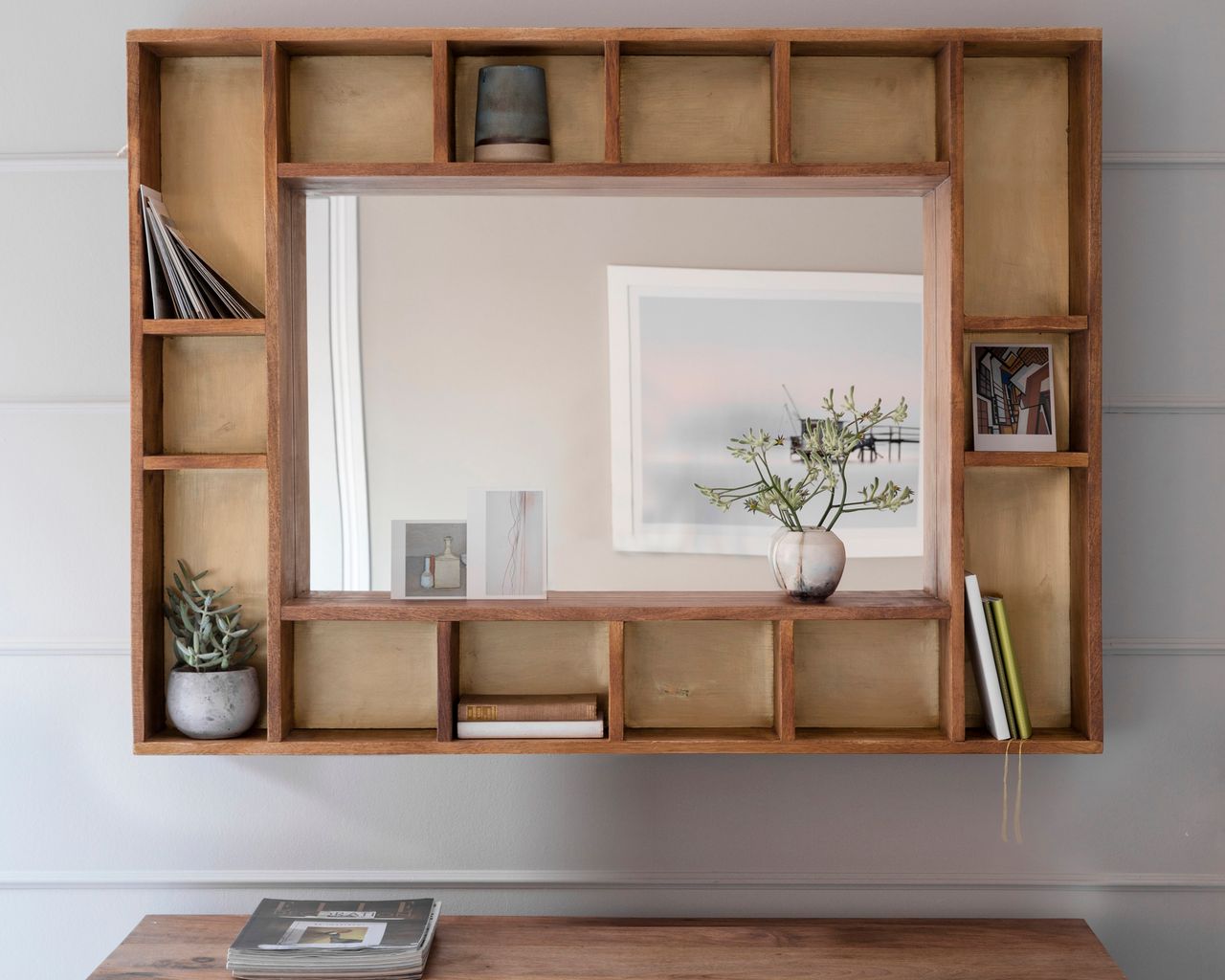 multifunctional wood mirror with incorporated pigeon holes for storage
