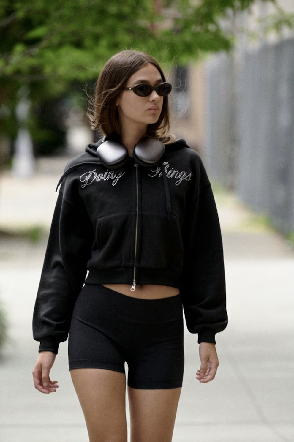 a model wears a pair of Outdoor Voices shorts with a rhinestone doing things jacket