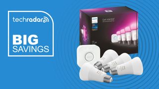 Philips Hue Starter Kit with four A19 light bulbs on blue background with white text reading "Big Savings"