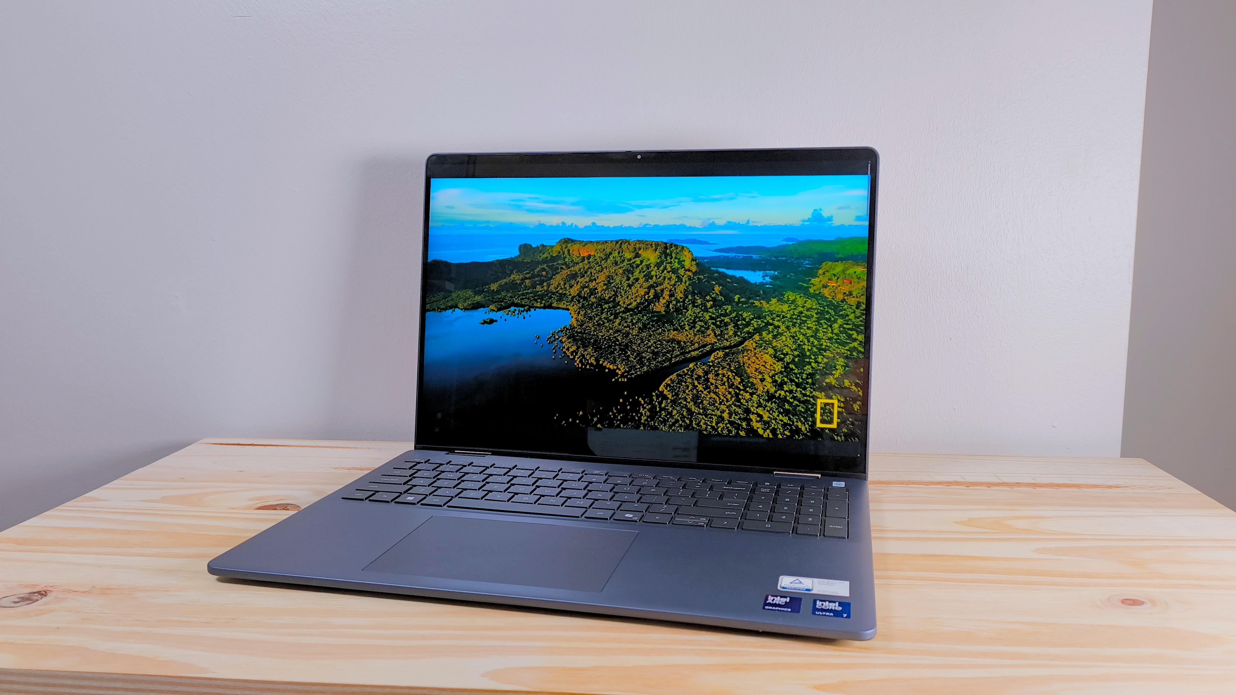 The Dell 16 Plus 2-in-1 on a wood table