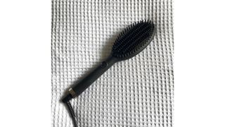 Original image showing the ghd Glide Hot Brush on a white textured background