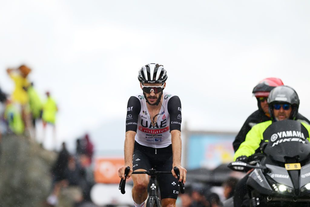 COL DE LA CROIX DE FER FRANCE JUNE 10 Adam Yates of The United Kingdom and UAE Team Emirates crosses the finish line during the 75th Criterium du Dauphine 2023 Stage 7 a 1479km stage from PortedeSavoie to Col de la Croix de Fer 2067m UCIWT on June 10 2023 in Col de la Croix de Fer France Photo by Dario BelingheriGetty Images