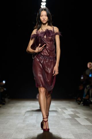 a model walks the Ferragamo fall/winter 2024 runway wearing T-bar pumps