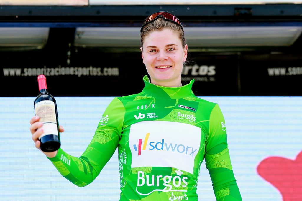 ARANDA DE DUERO SPAIN MAY 19 Lotte Kopecky of Belgium and Team SD Worx celebrates winning the Green Points Jersey on the podium ceremony after the 7th Vuelta a Burgos Feminas 2022 Stage 1 a 1219km stage from Pedrosa del Prncipe to Aranda de Duero VueltaBurgos BurgosFem on May 19 2022 in Aranda de Duero Spain Photo by Gonzalo Arroyo MorenoGetty Images