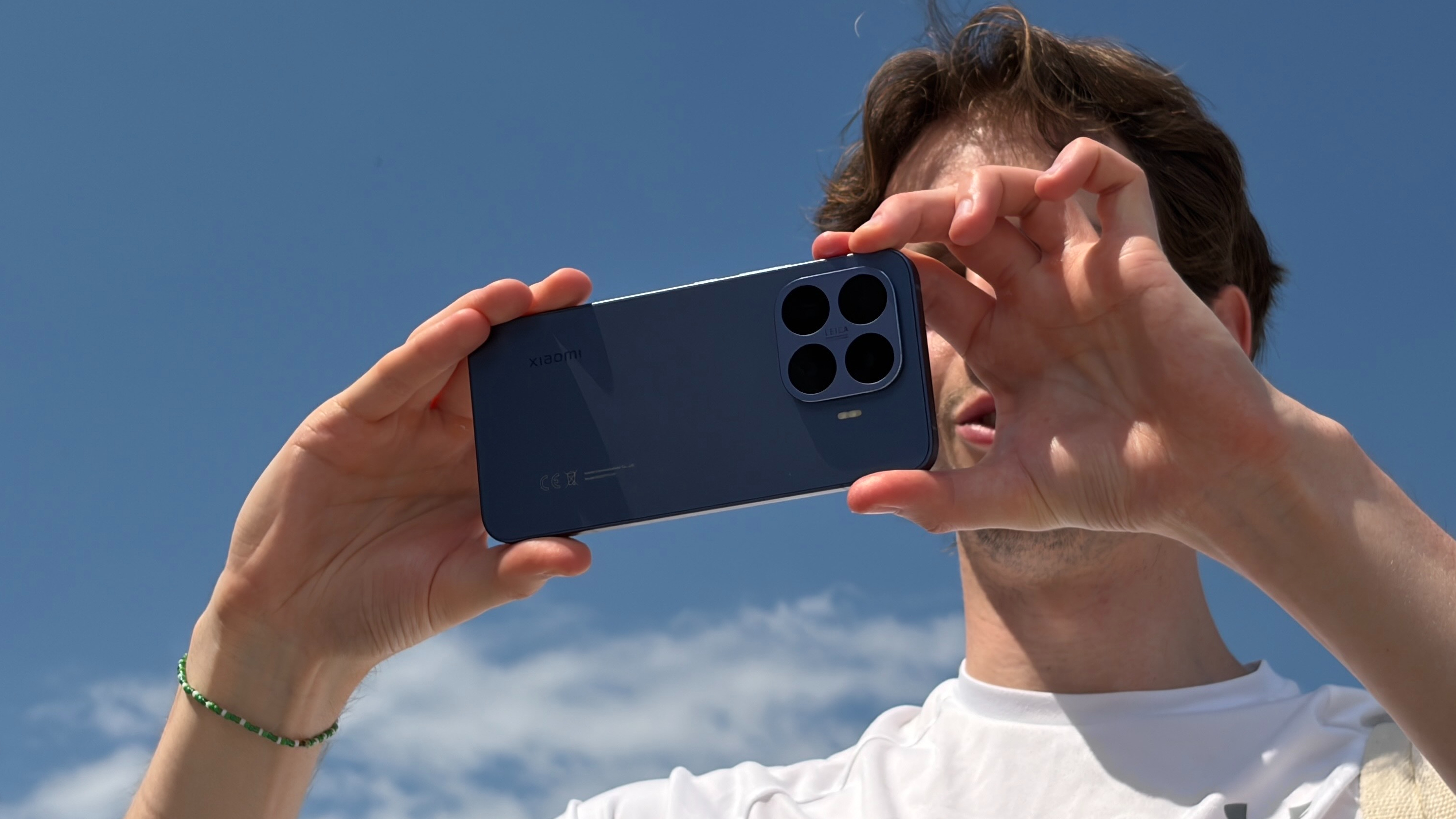 A man holding the Xiaomi 17T Pro with two hands