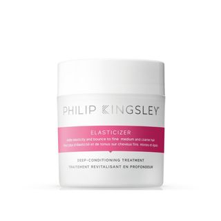 Philip Kingsley Elasticizer Deep-Conditioning Treatment in a white and pink jar.