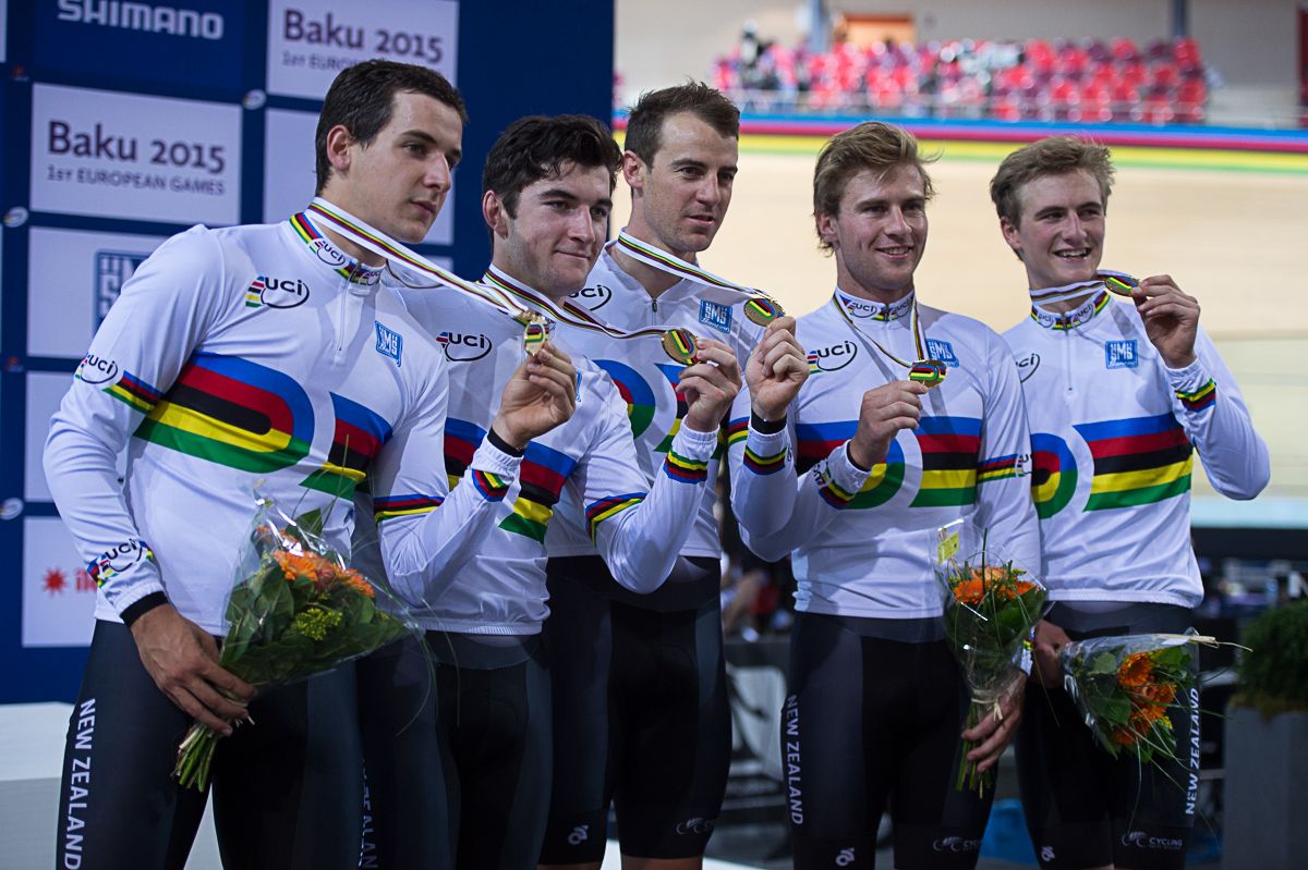 The New Zealand team pursuit riders on the podium in their rainbow jerseys