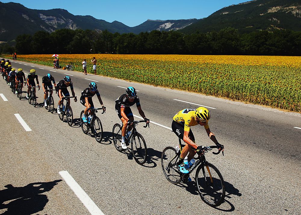 Chris Froome and Team Sky line up at the front of the peloton