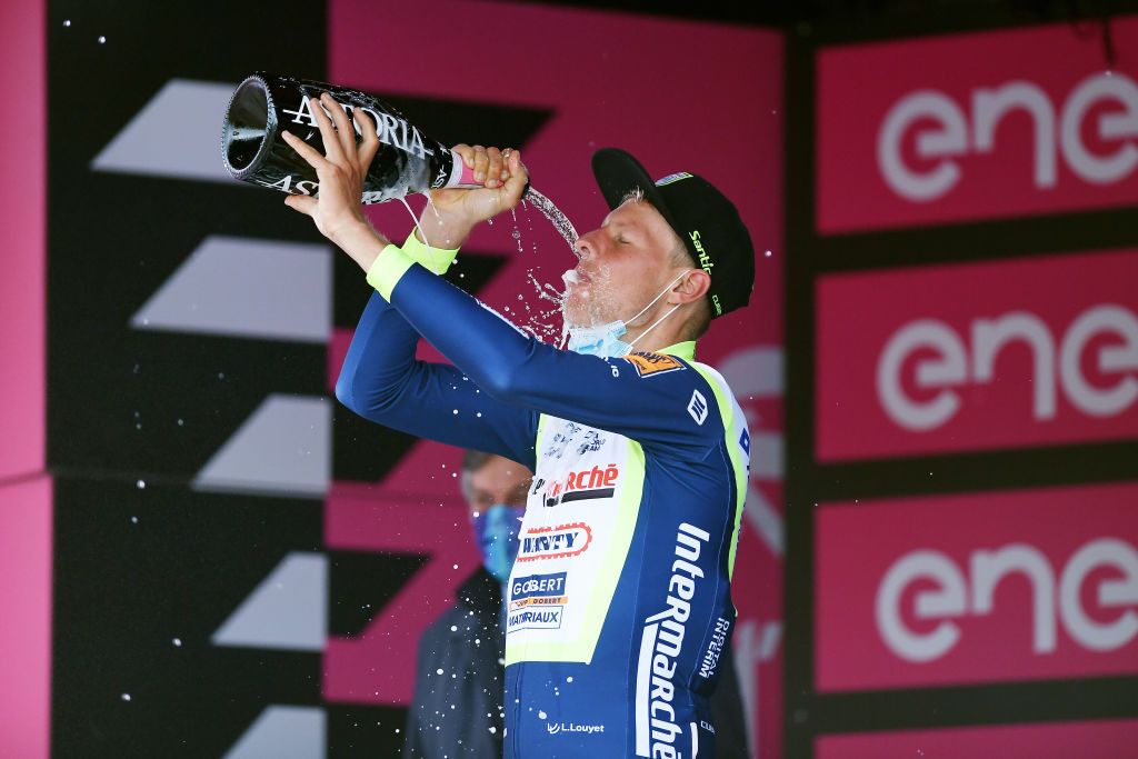 CANALE ITALY MAY 10 Taco Van Der Hoorn of Netherlands and Team Intermarch Wanty Gobert Matriaux celebrates at podium during the 104th Giro dItalia 2021 Stage 3 a 190km stage from Biella to Canale Trophy Champagne girodiitalia Giro on May 10 2021 in Canale Italy Photo by Tim de WaeleGetty Images