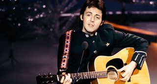 Paul McCartney plays a Martin dreadnought onstage in 1977