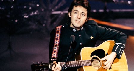 Paul McCartney plays a Martin dreadnought onstage in 1977