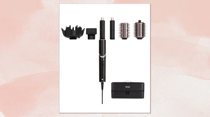 Image of a black and pink Shark FlexStyle tool and styling attachments, on a pink watercolour background