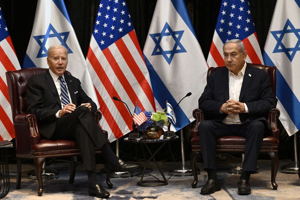 President Joe Biden listens to Israel&#039;s Prime Minister Benjamin Netanyahu as he joins a meeting of the Israeli war cabinet in Tel Aviv on October 18, 2023