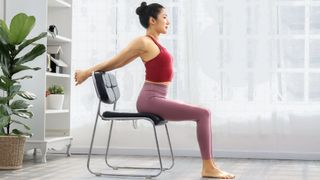 Woman doing a yoga stretch as part of a chair yoga session