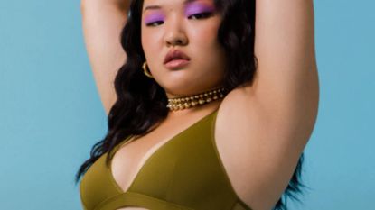 Woman wearing green Parade bralette