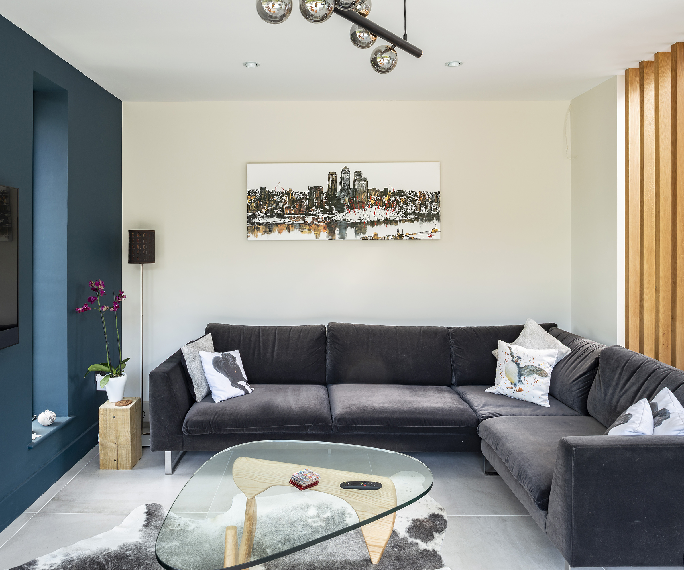 A corner sofa in a living room area of a kitchen extension
