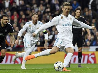 Cristiano Ronaldo scores a penalty against Paris Saint-Germain in the Champions League in February 2018.