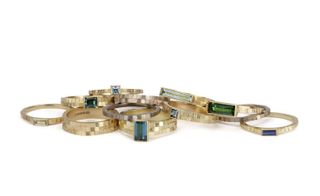 rings studded with tourmalines and sapphires