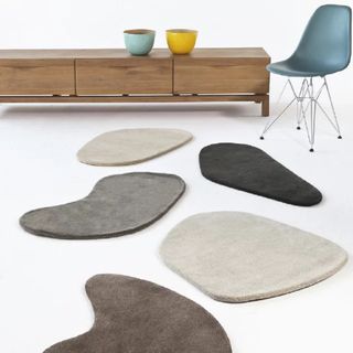 An irregular rug designed to mimic stones