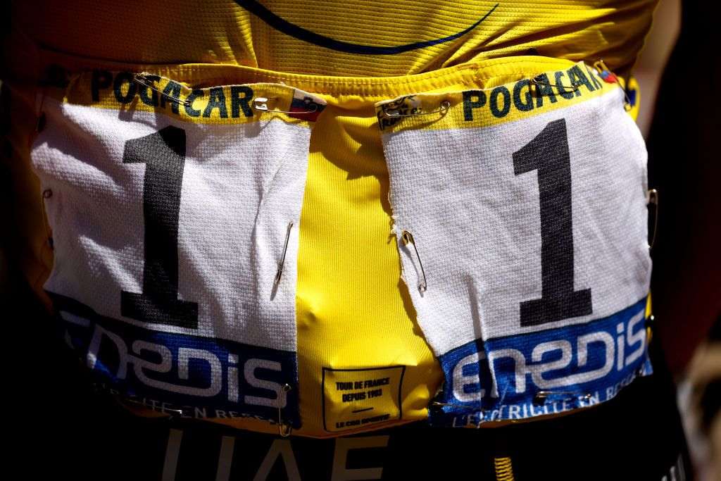 NMES FRANCE JULY 08 Tadej Pogaar of Slovenia and UAETeam Emirates Yellow Leader Jersey at start during the 108th Tour de France 2021 Stage 12 a 1594km stage from SaintPaulTroisChateaux to Nimes BIB Number Detail view LeTour TDF2021 on July 08 2021 in Nmes France Photo by Chris GraythenGetty Images