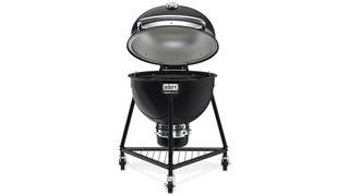 Weber Kamado Summit charcoal BBQ shown with lid open on a white background