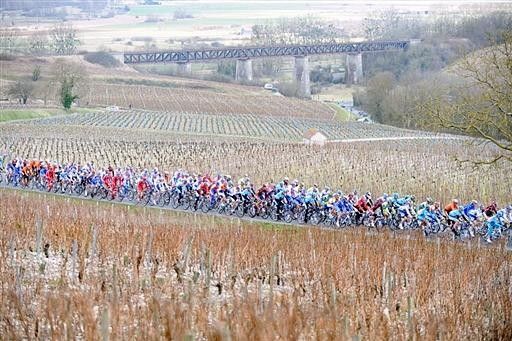 These same fields will explode with colour in the summer but are brown as the peloton rolls through in March.