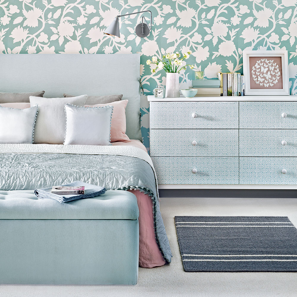 bedroom with floral wallpaper and carpet floor