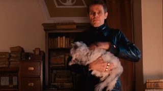 Willem Dafoe holding a cat in The Grand Budapest Hotel