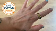A Live Science deal logo and a picture of our reviewer's hand wearing the Oura Ring Gen 3