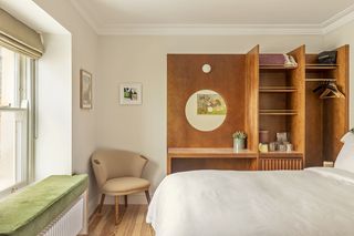 Fort Road hotel bedroom with built in wooden wardrobe