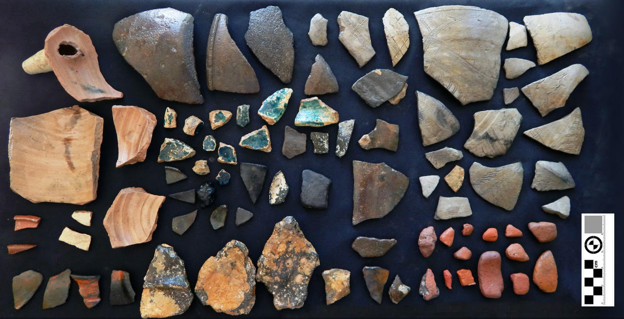 An array of ceramic shards laid out on a table