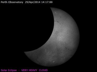 This view of the solar eclipse of April 29, 2014 was captured by astronomers with the Perth Observatory in Western Australia, where a partial eclipse was visible through heavy clouds during the annular solar eclipse.