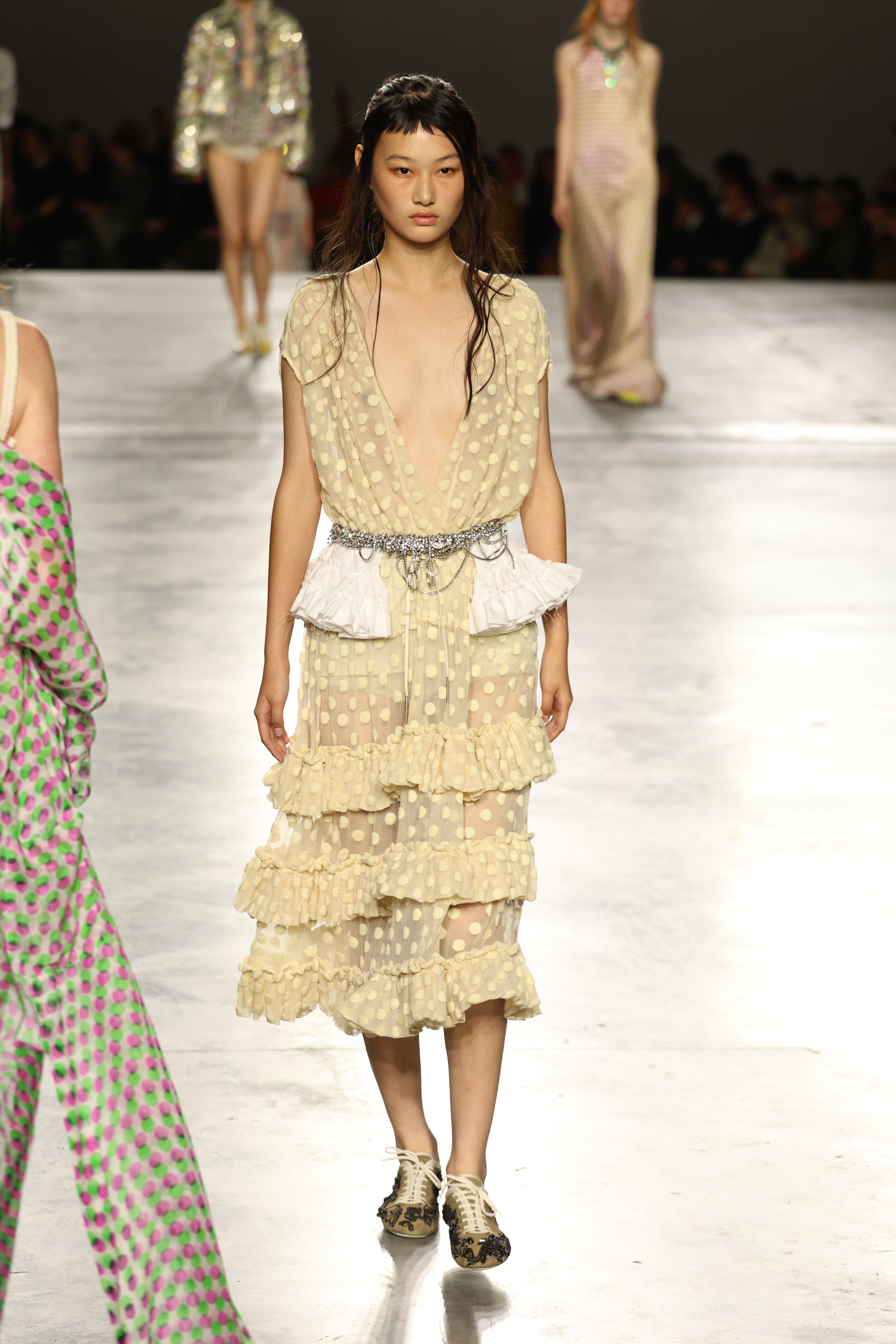 A model wore a polka-dot dress on the Dries Van Noten runway