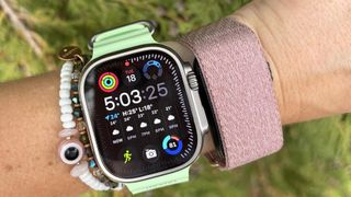 the Apple Watch Ultra 3 and Garmin Cirqa on wrist 