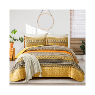 Patterned yellow orange quilted bedding set