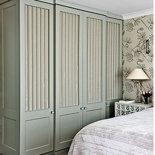 wardrobe with lamp and bed