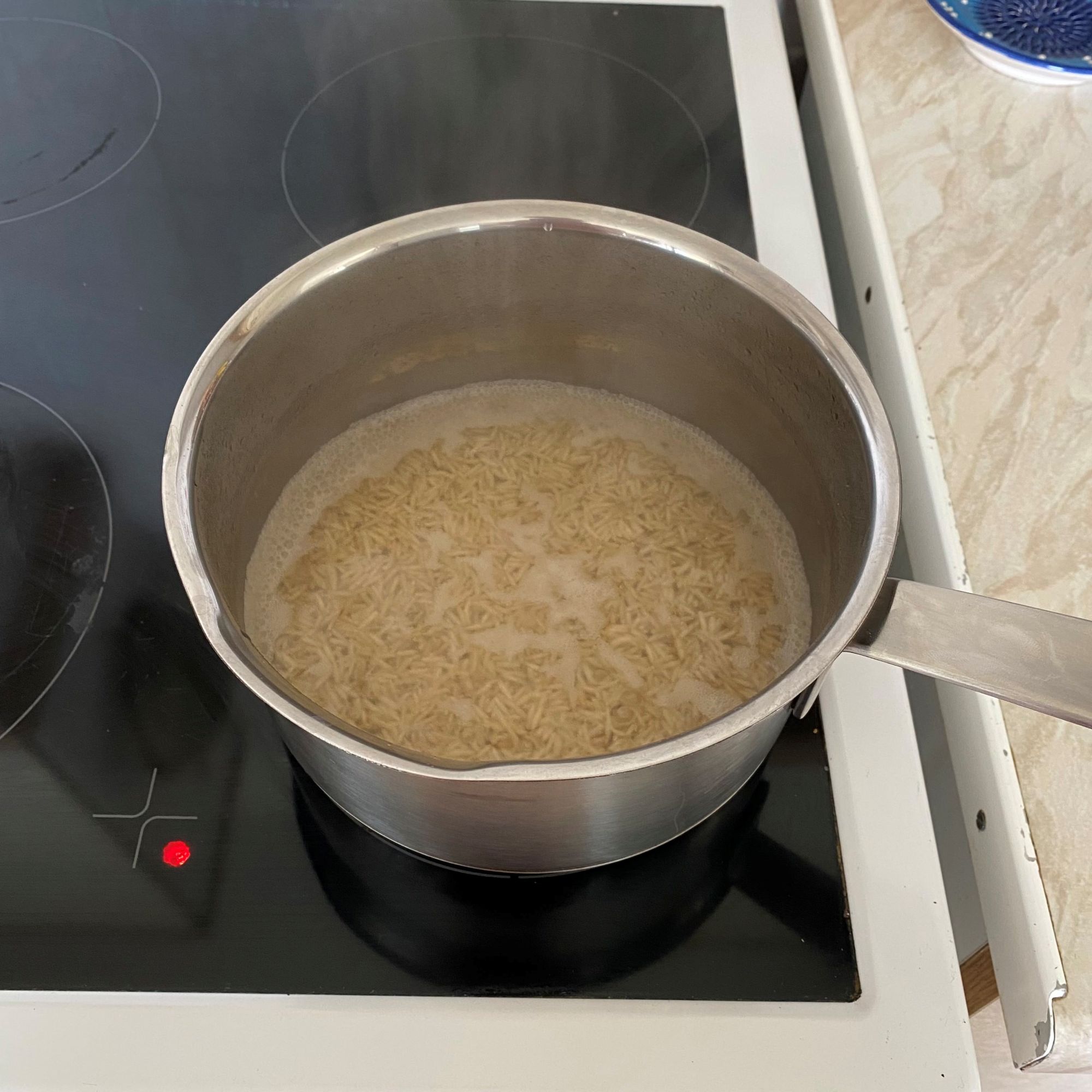 rice cooking in IKEA HEMKOMST pan
