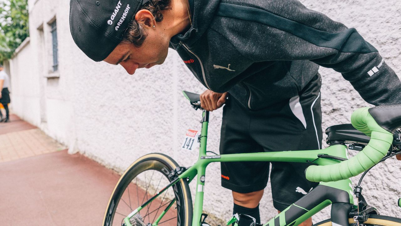 Matthews takes a look at his custom finished bike