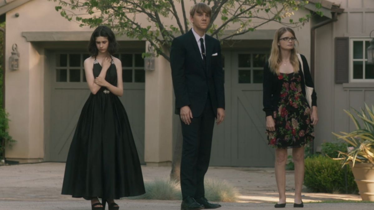 Maeve Press, Josh Thomas, and Kayla Cromer standing together in a driveway in Everything&#039;s Gonna Be Okay.