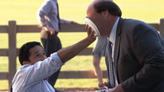 Oscar pushing pie into Kevin's face in The Office